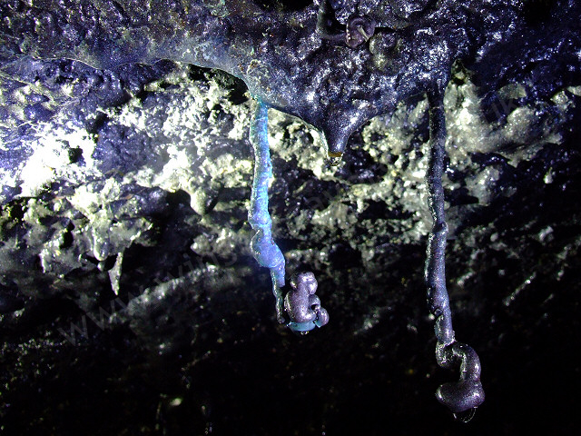 Copper stained stalactities in a lava tube.