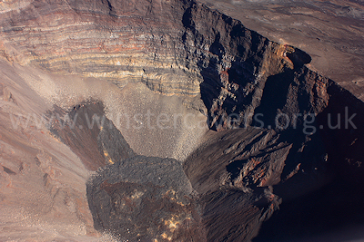 An aerial view of the Dolomieu crater - the dark lava flows are from the small eruption of January 2009