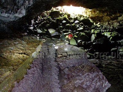 Coloured lava channels in a lava tube near Volcano Village, Hawaii